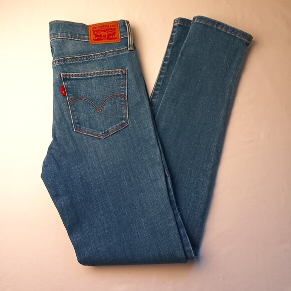 Levi's Denim Jeans Size 27/4 Slimming Skinny Mid Rise Medium Wash - Picture 1 of 11